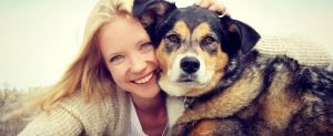 happy woman with emotional support dog