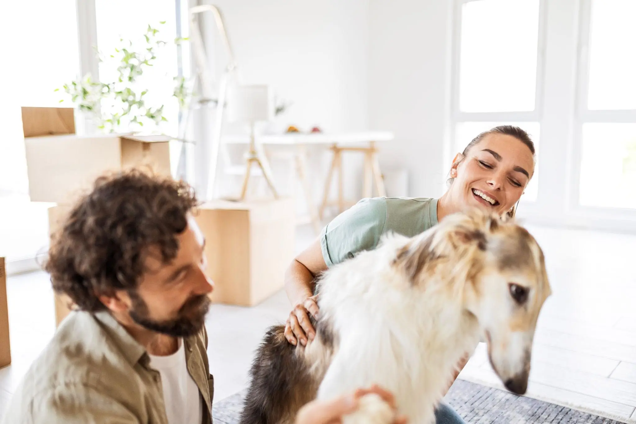 Woman relaxing with her emotional support dog at home